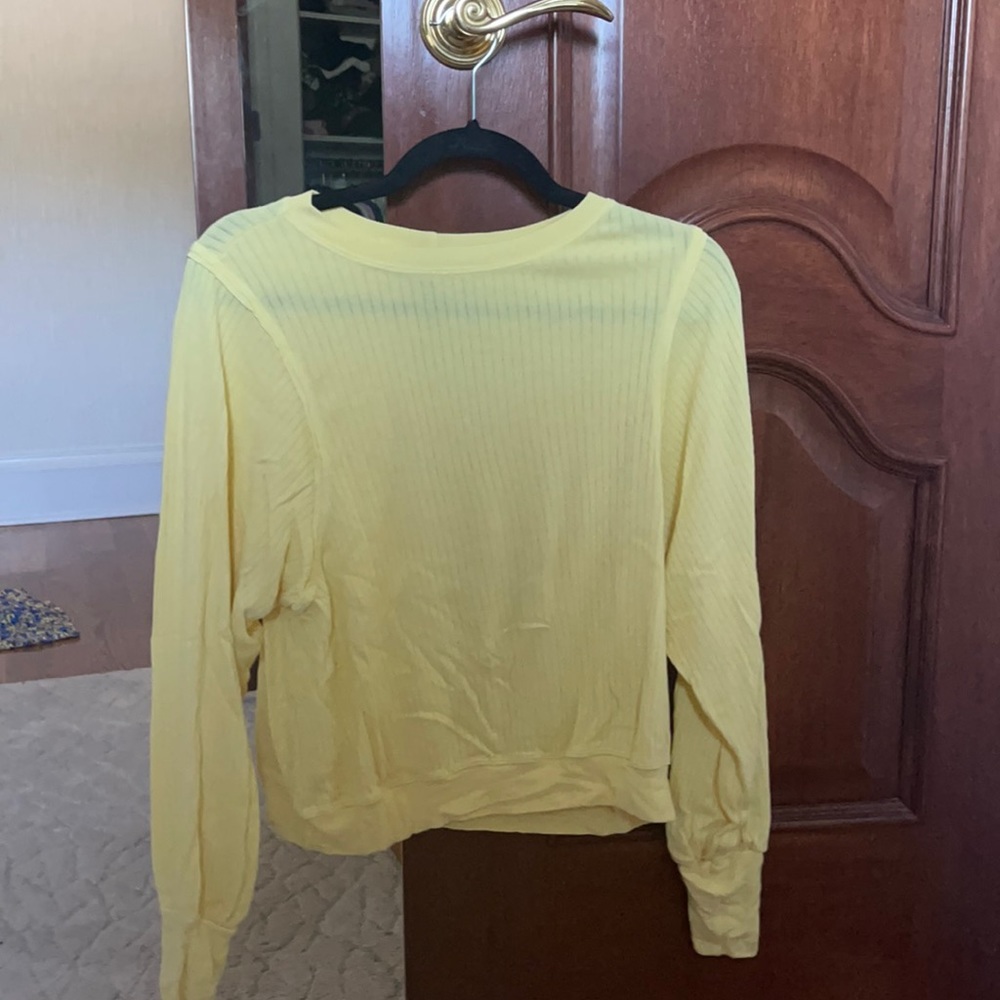 Yellow top that’s lightly worn (once or twice).